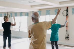 Three people doing tai chi