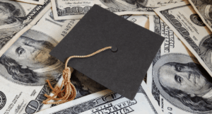 Images of money underneath graduation cap