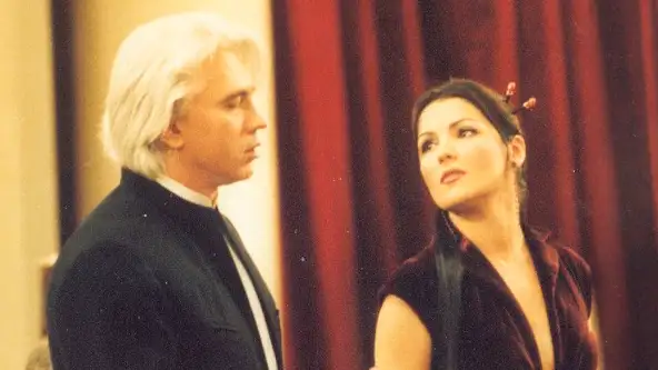 a woman and man performing onstage