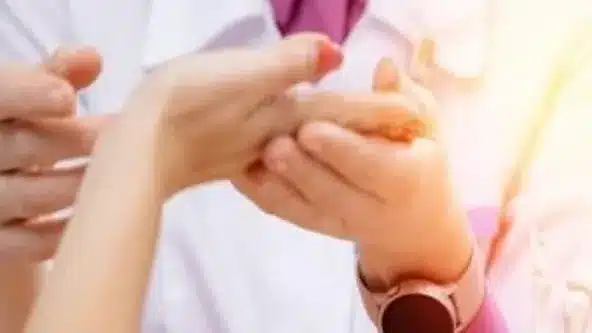 a doctor holding a persons hand