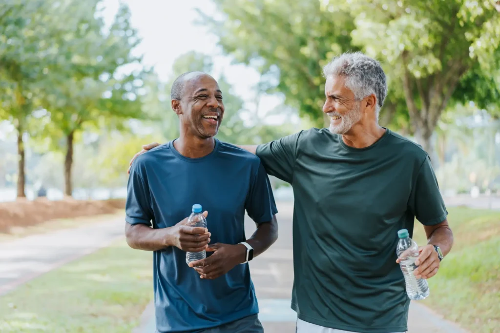 Wellness Uncovered: The Power of Whole-Person Wellness for Seniors 3 Two men walking outside